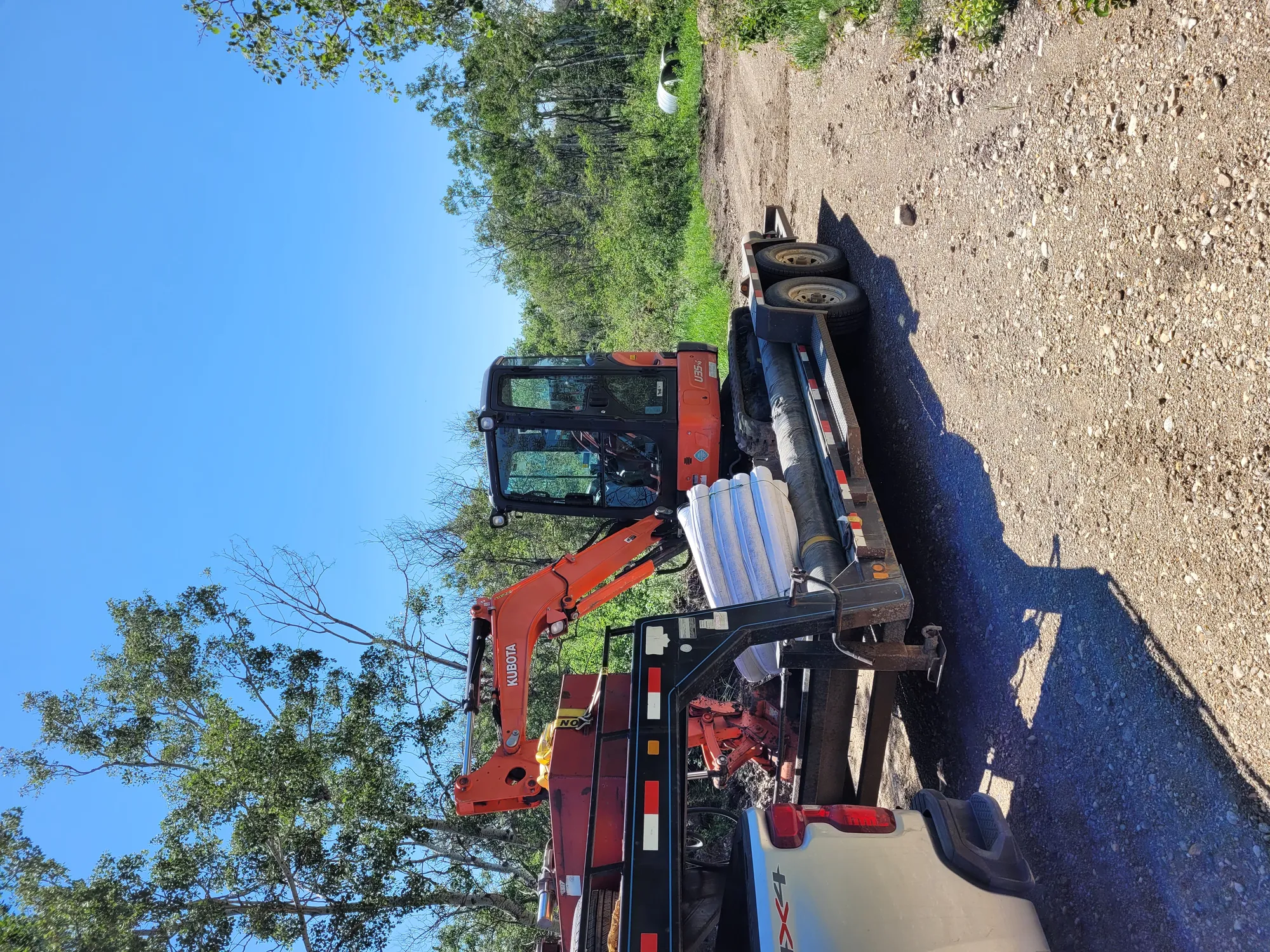 Excavator ready to carve trench and install new pipe